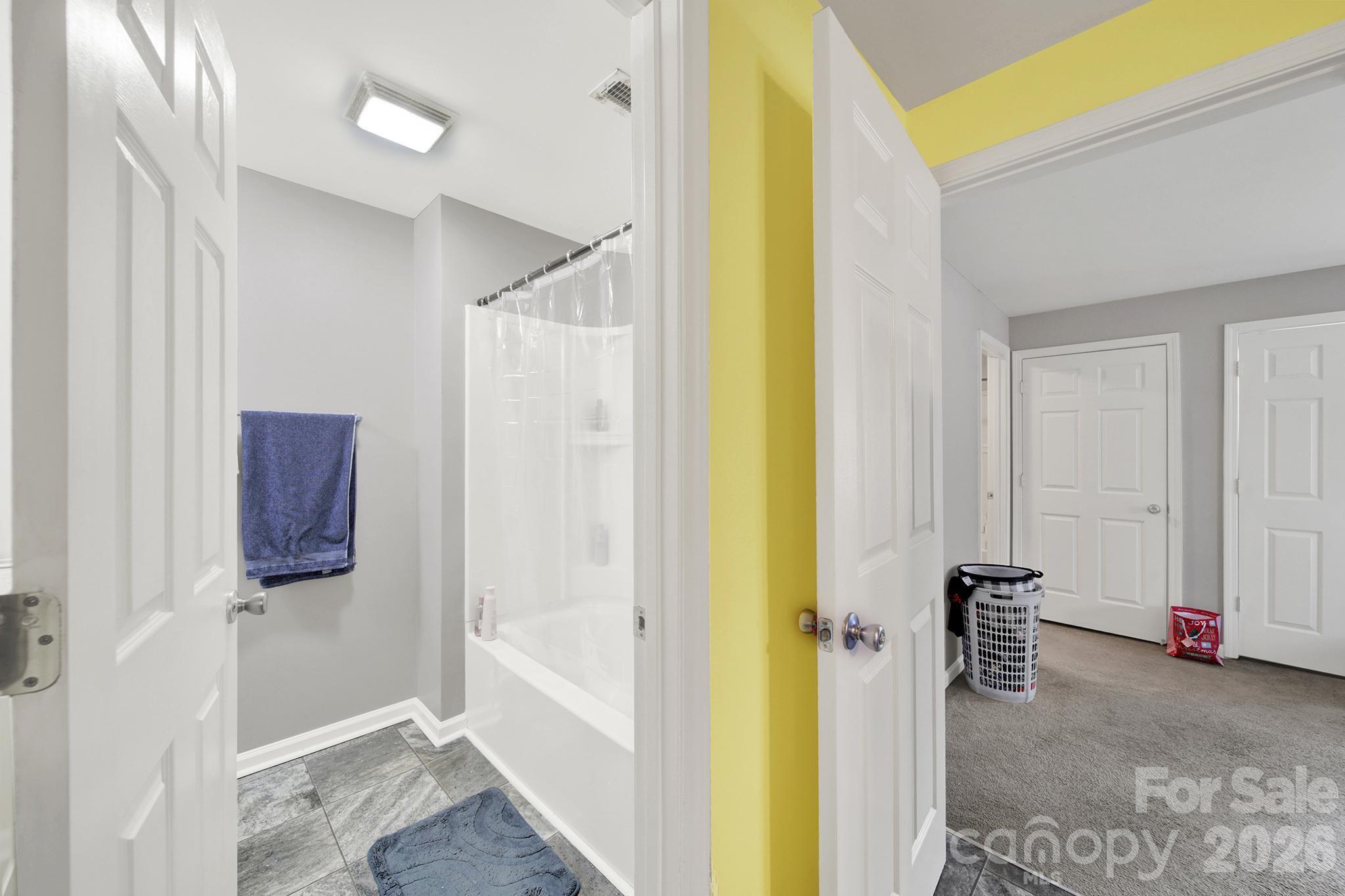 2503 Lancaster Highway Monroe, NC 28112 - Photo 15 of 26 a view of a bathroom with a bathtub and a shower