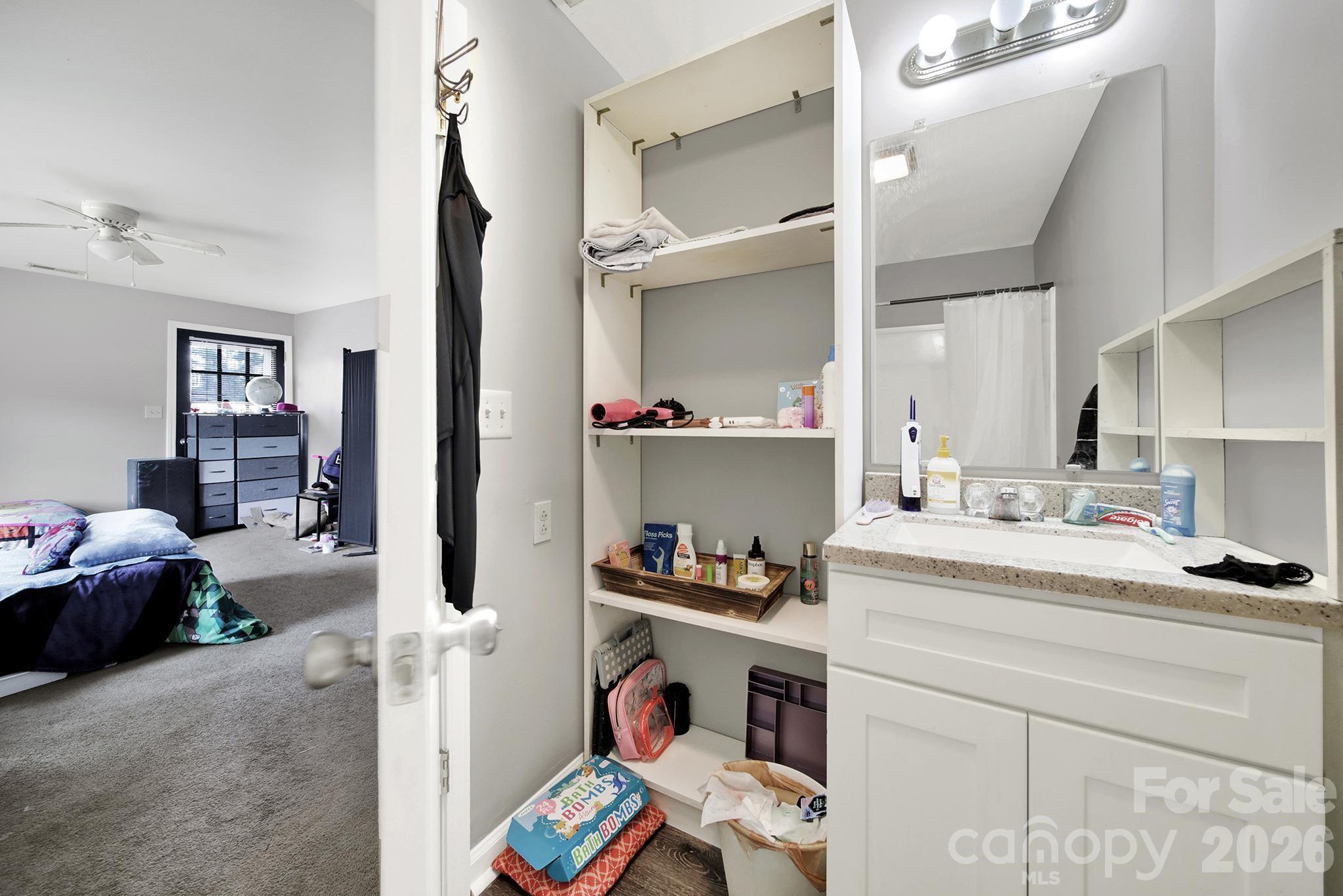 2503 Lancaster Highway Monroe, NC 28112 - Photo 18 of 26 a bedroom with a bed and a cabinets