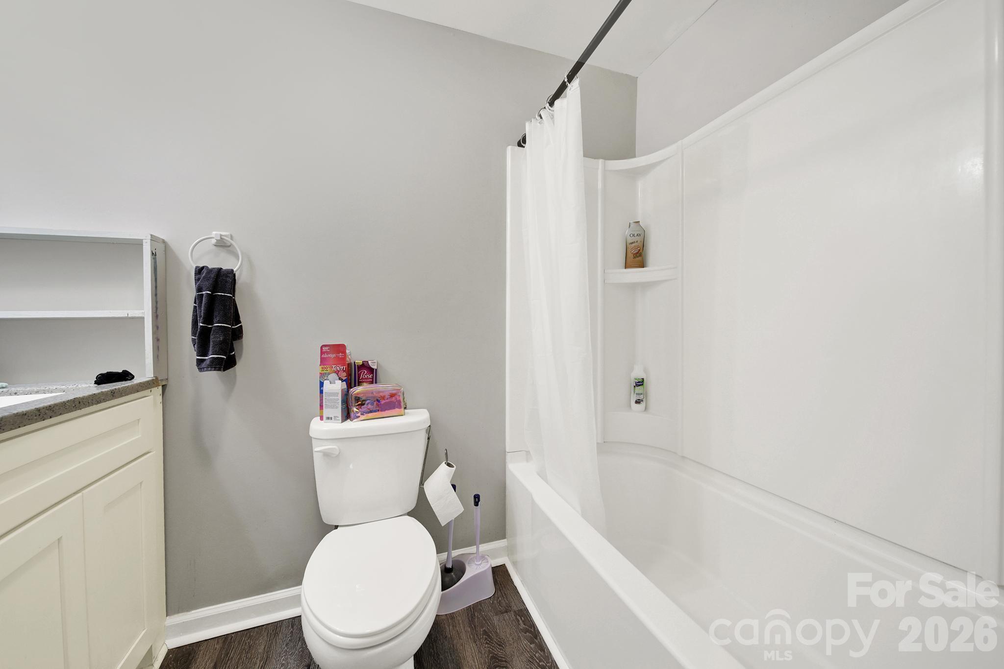 2503 Lancaster Highway Monroe, NC 28112 - Photo 19 of 26 a white toilet sitting next to a bath tub