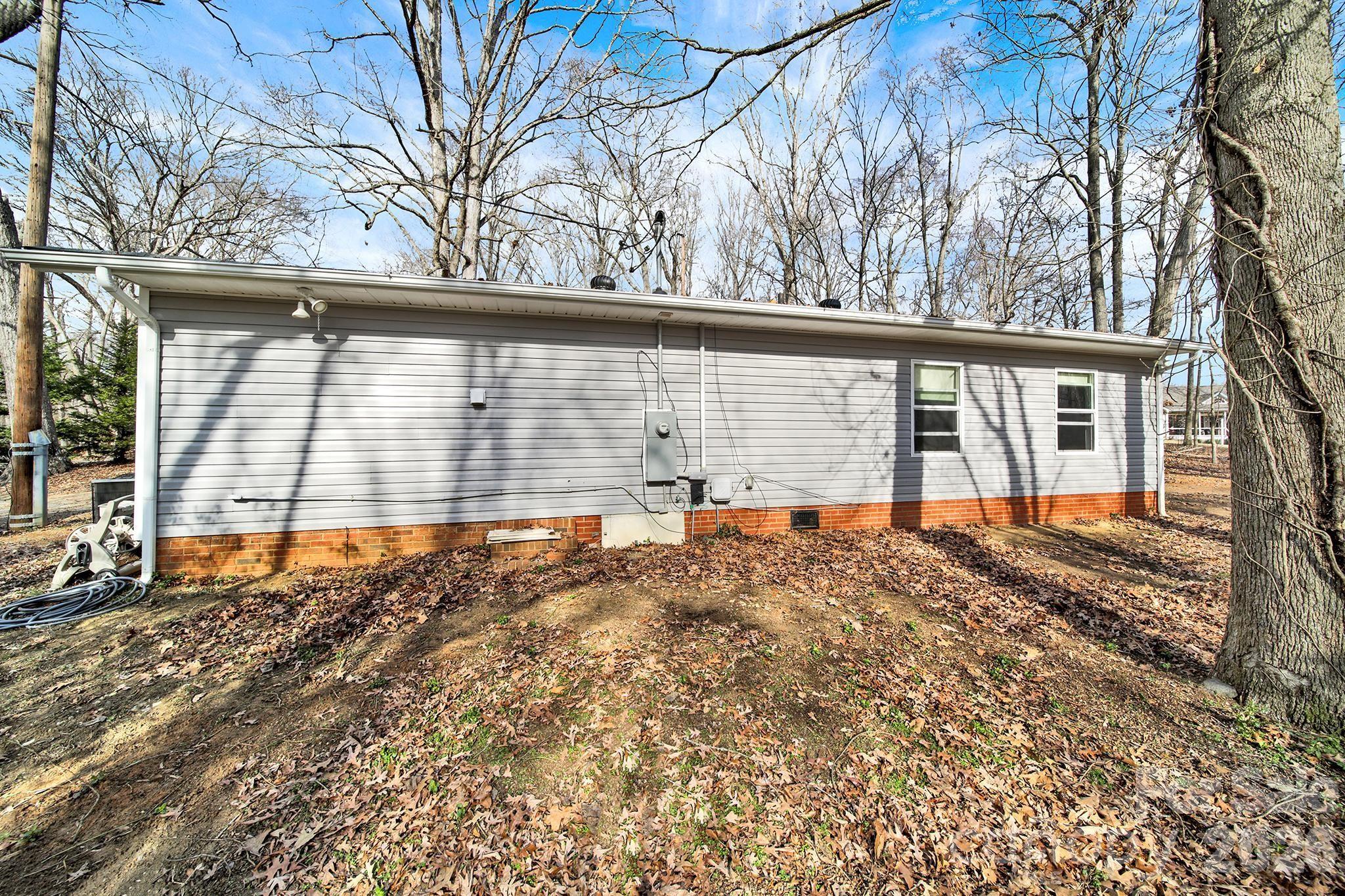 2503 Lancaster Highway Monroe, NC 28112 - Photo 21 of 26 a view of a house with a large tree