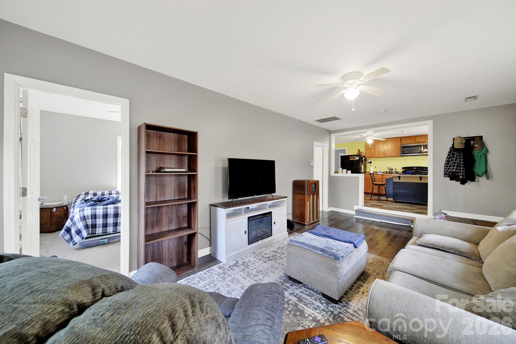 2503 Lancaster Highway Monroe, NC 28112 - Photo 5 of 26 a living room with furniture and a flat screen tv
