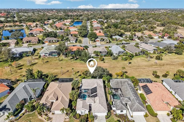 an aerial view of residential houses with outdoor space