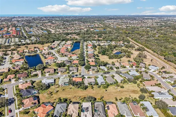 an aerial view of residential houses with outdoor space