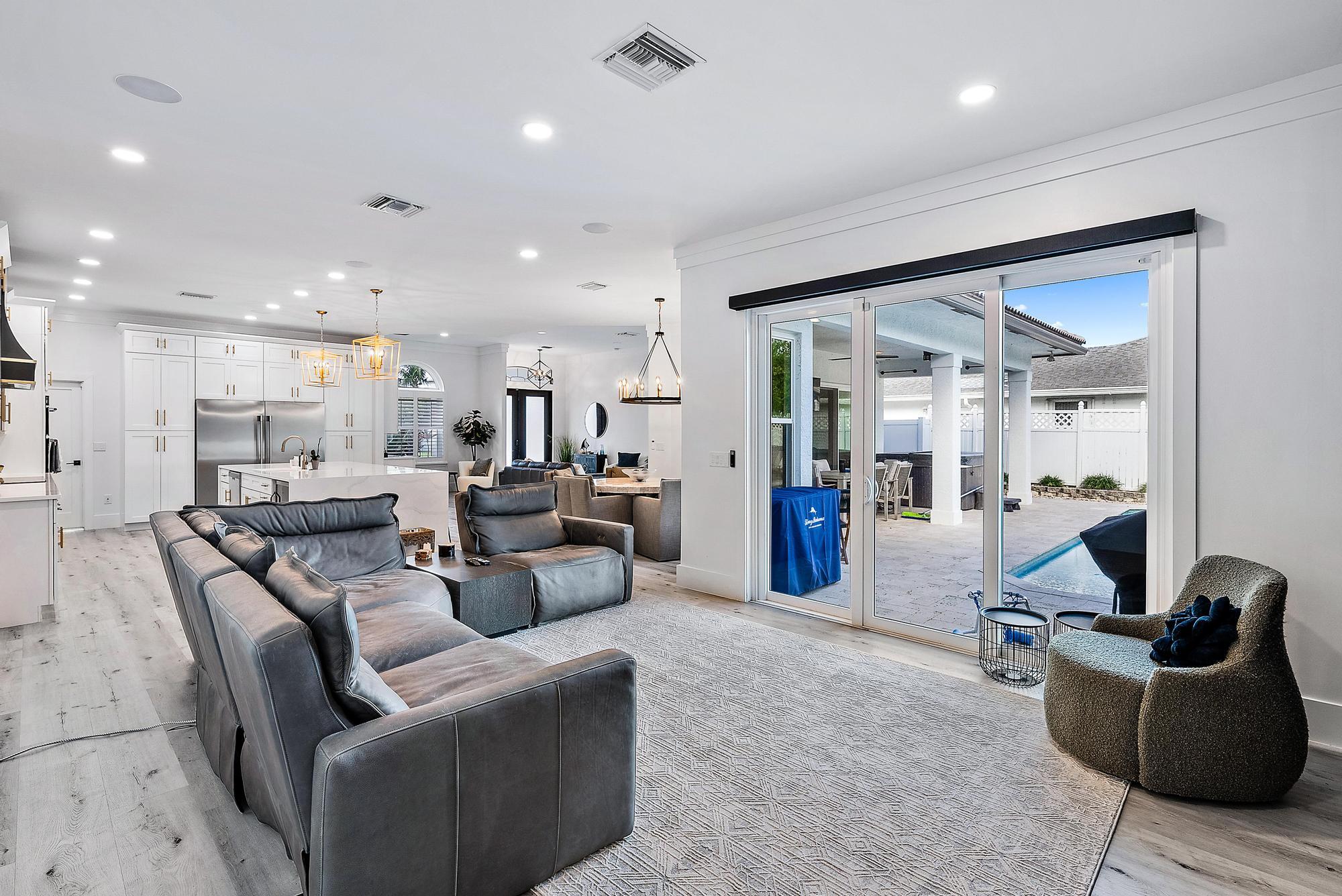 596 North Cypress Drive Tequesta, FL 33469 - Photo 15 of 28 a living room with furniture and kitchen view