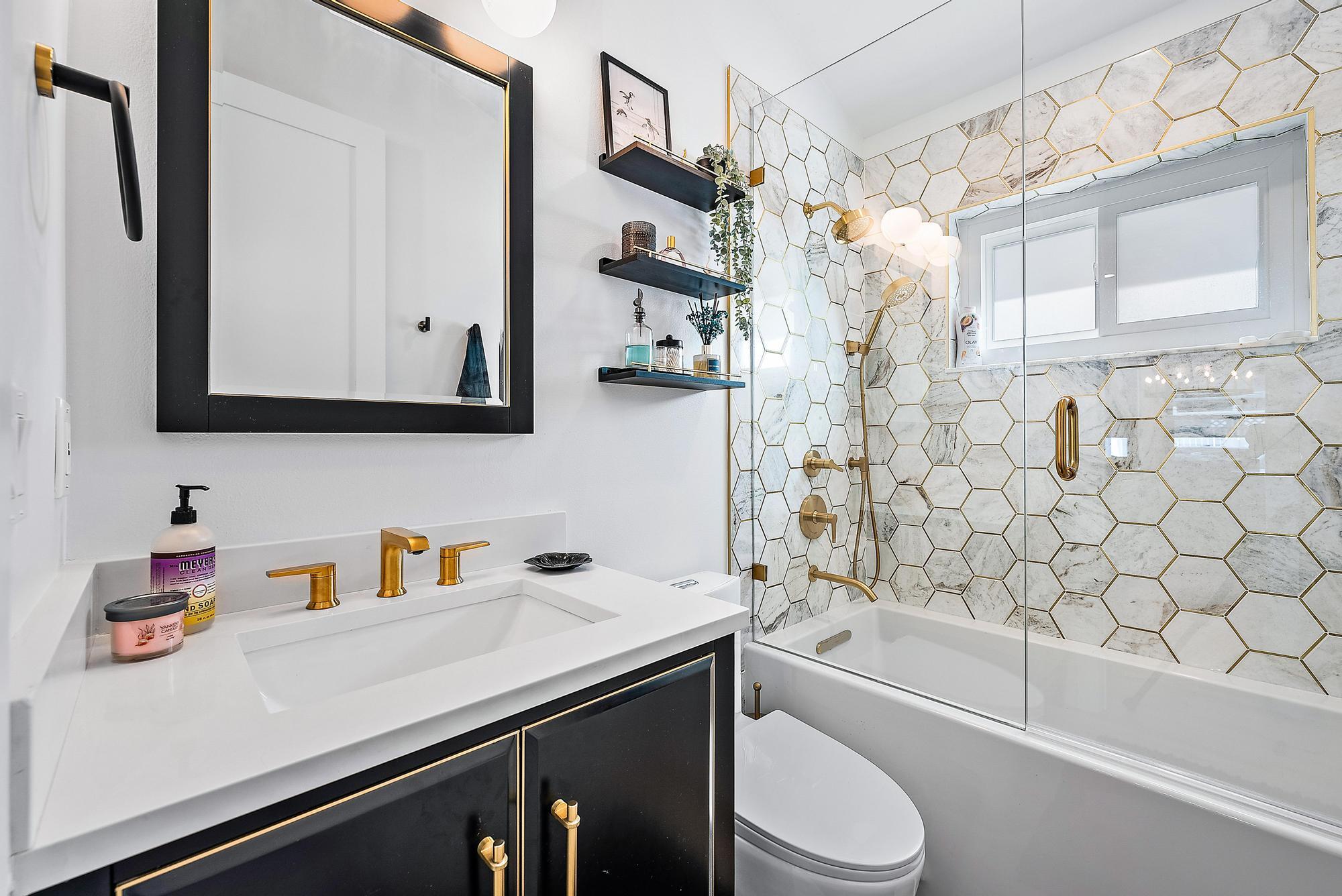 596 North Cypress Drive Tequesta, FL 33469 - Photo 22 of 28 a bathroom with a sink a toilet and bathtub