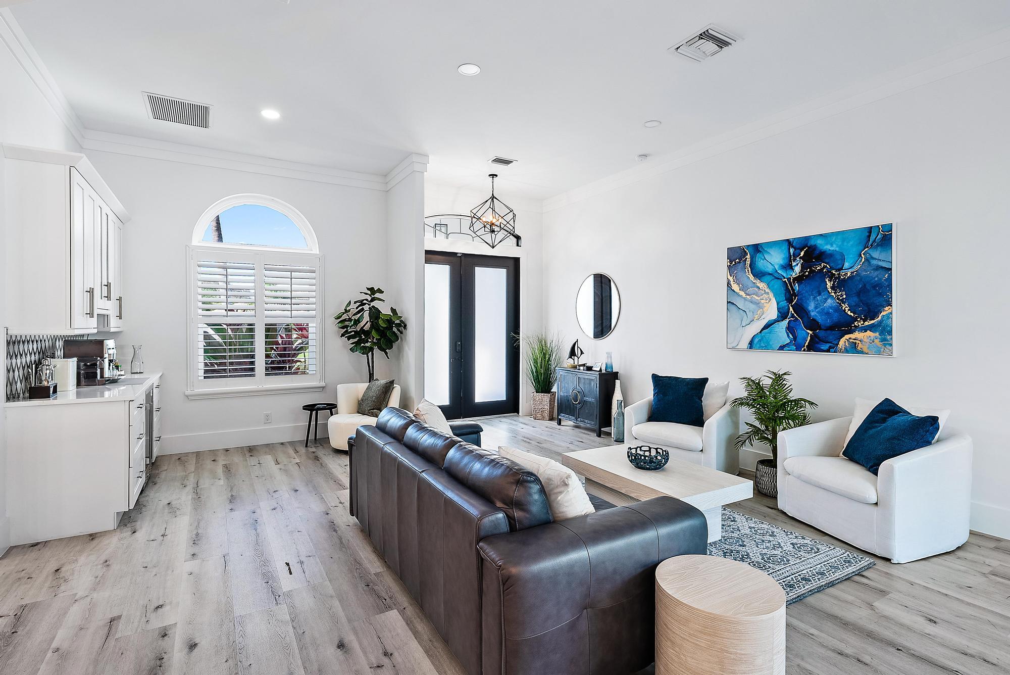 596 North Cypress Drive Tequesta, FL 33469 - Photo 5 of 28 a living room with furniture fireplace and window