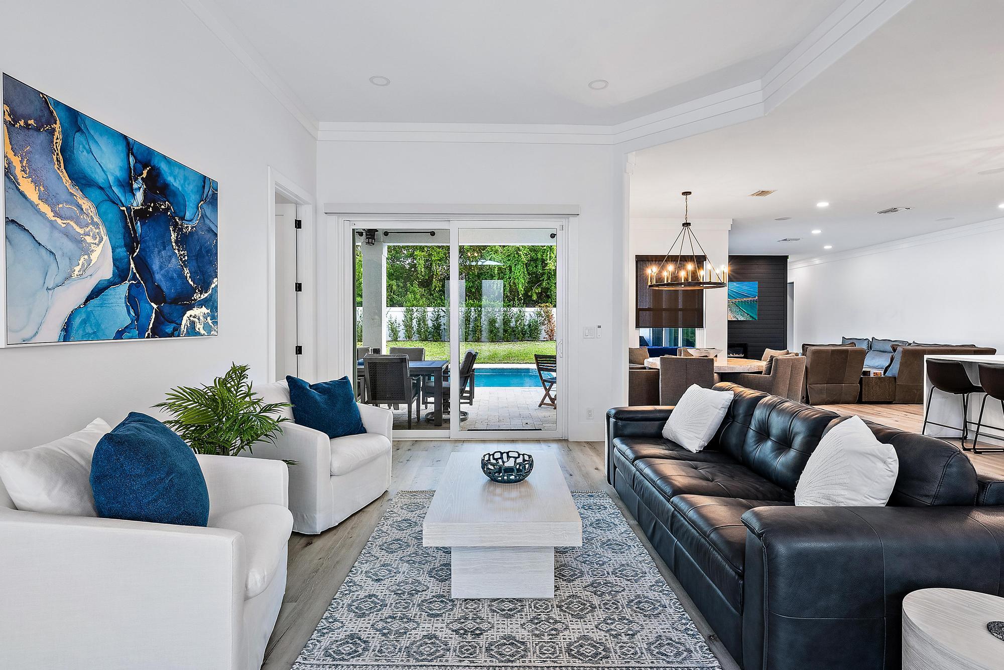 596 North Cypress Drive Tequesta, FL 33469 - Photo 6 of 28 a living room with furniture and a large window