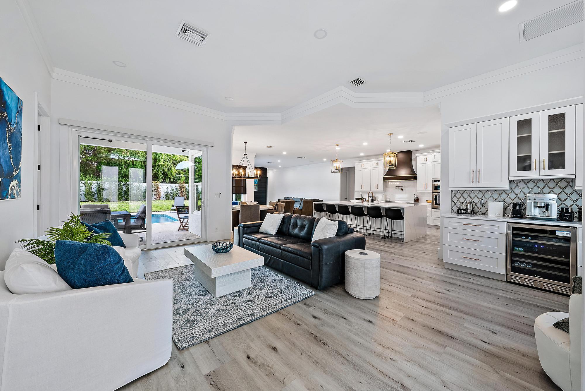 596 North Cypress Drive Tequesta, FL 33469 - Photo 7 of 28 a living room with furniture and a large window