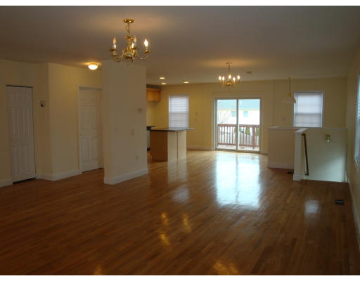 37 Lund Road Medford, MA 02155 - Photo 5 of 13 a view of an empty room with kitchen and window