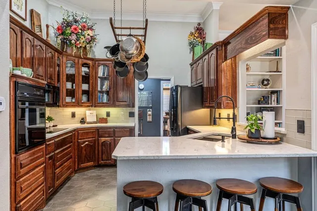 a kitchen with a table and chairs in it