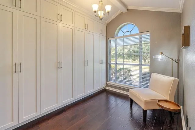 a view of a livingroom with furniture and a window