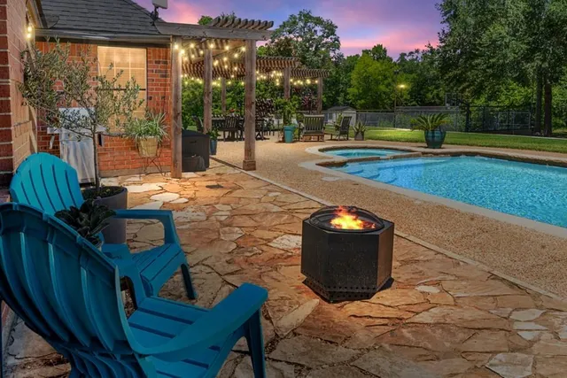a view of a chairs and table in the patio