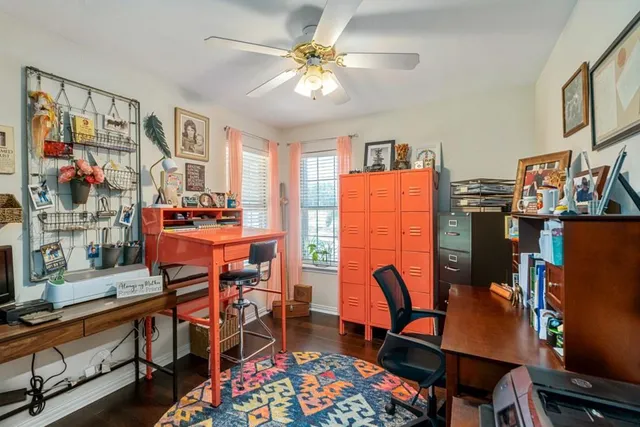 a view of a workspace with furniture and a workspace