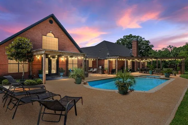 a front view of house with yard and outdoor seating