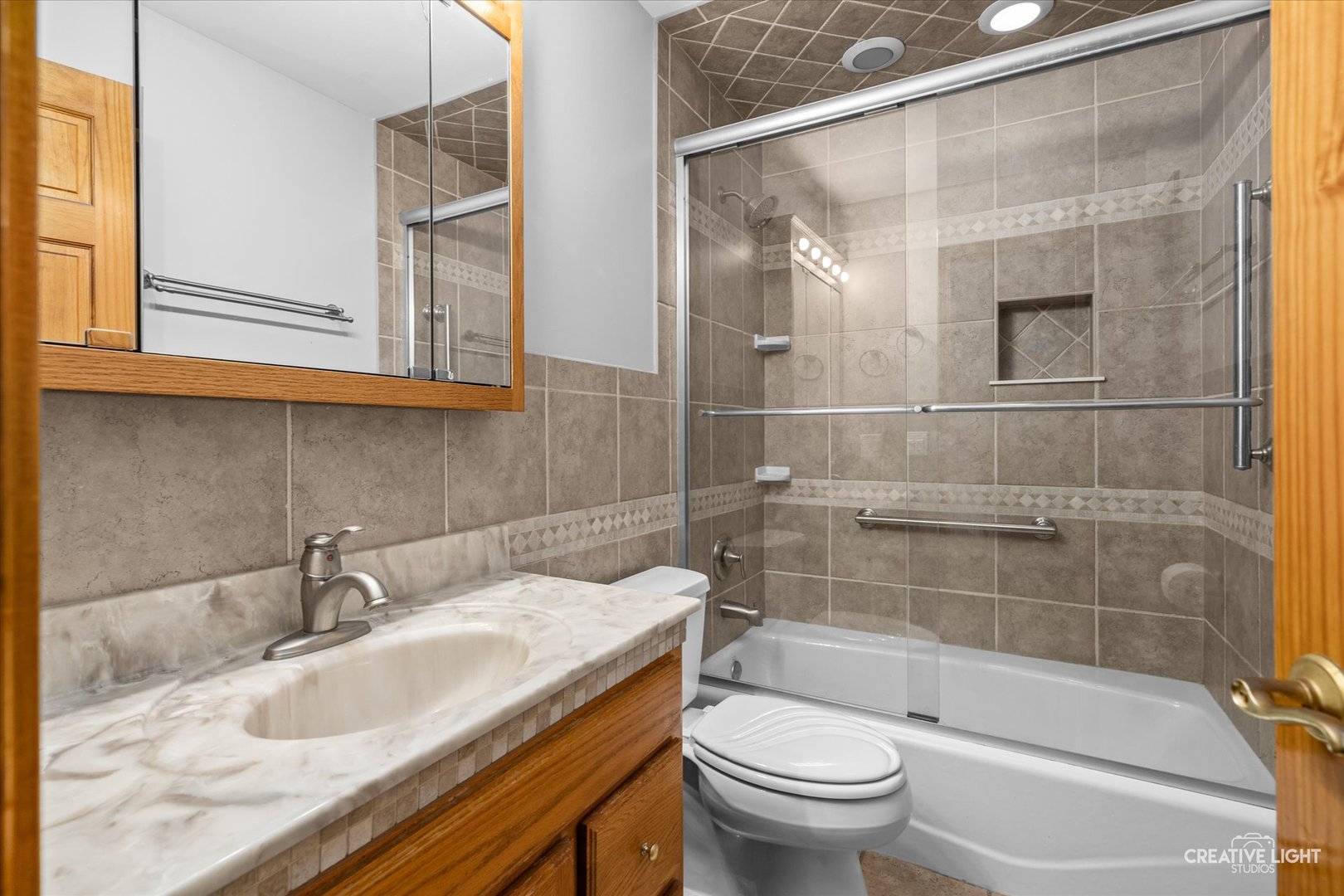 1111 Laurel Drive Aurora, IL 60506 - Photo 11 of 22 a bathroom with a sink and a mirror