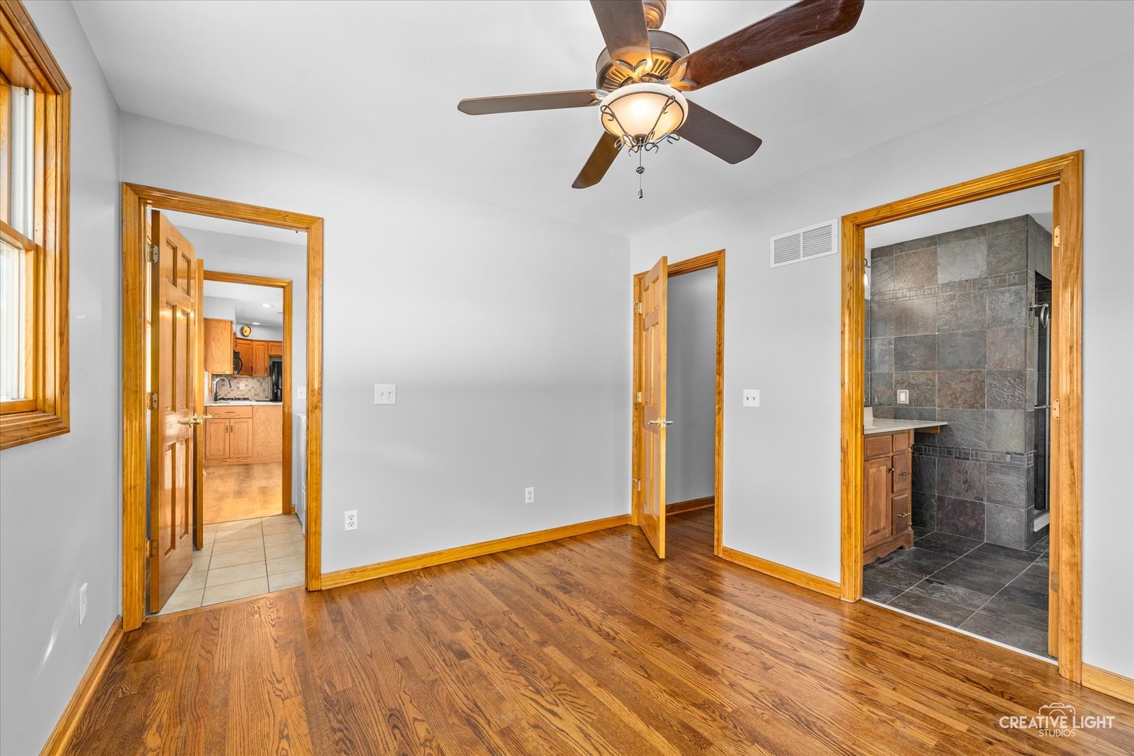 1111 Laurel Drive Aurora, IL 60506 - Photo 13 of 22 wooden floor in an empty room with a window