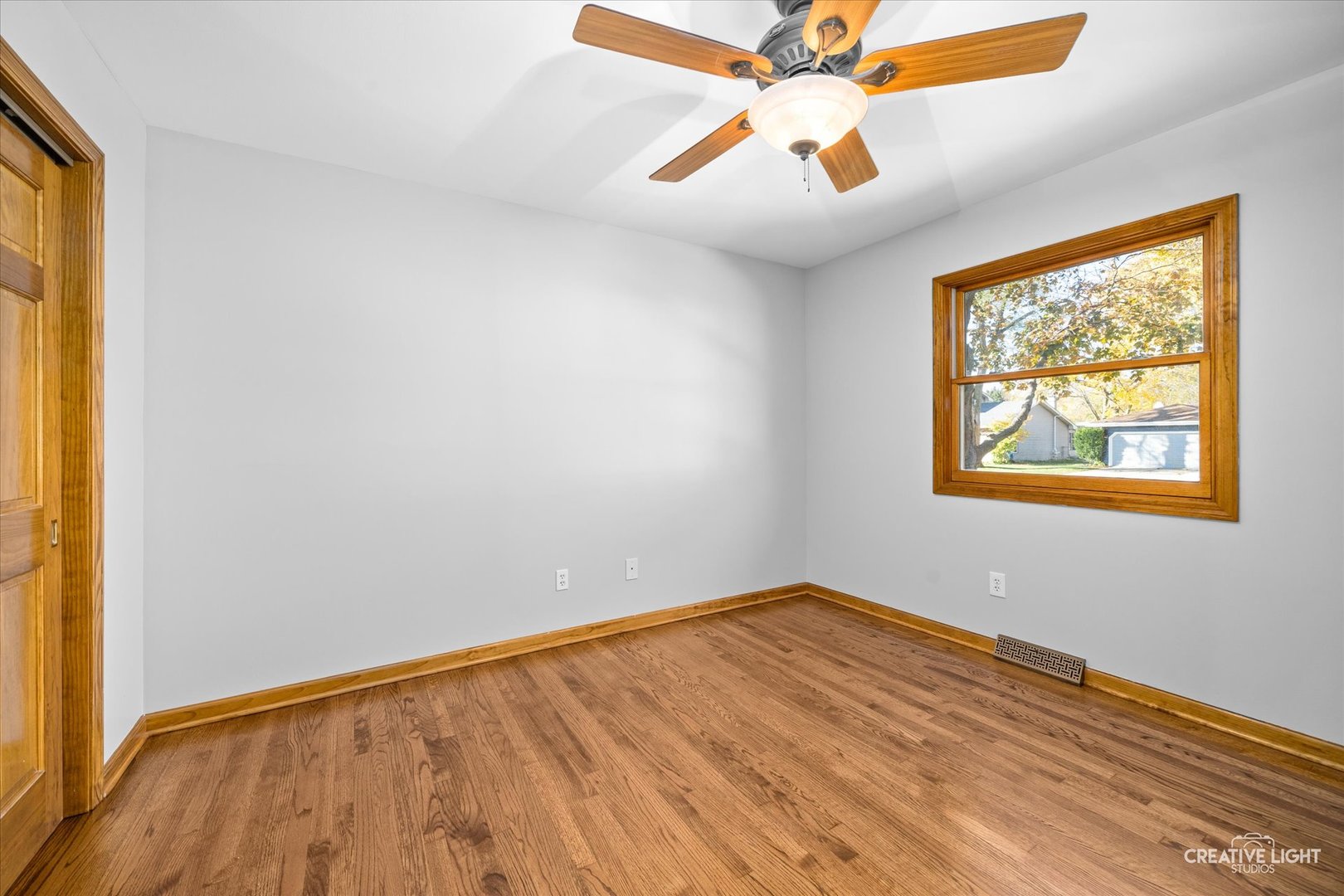 1111 Laurel Drive Aurora, IL 60506 - Photo 17 of 22 wooden floor in an empty room with a window