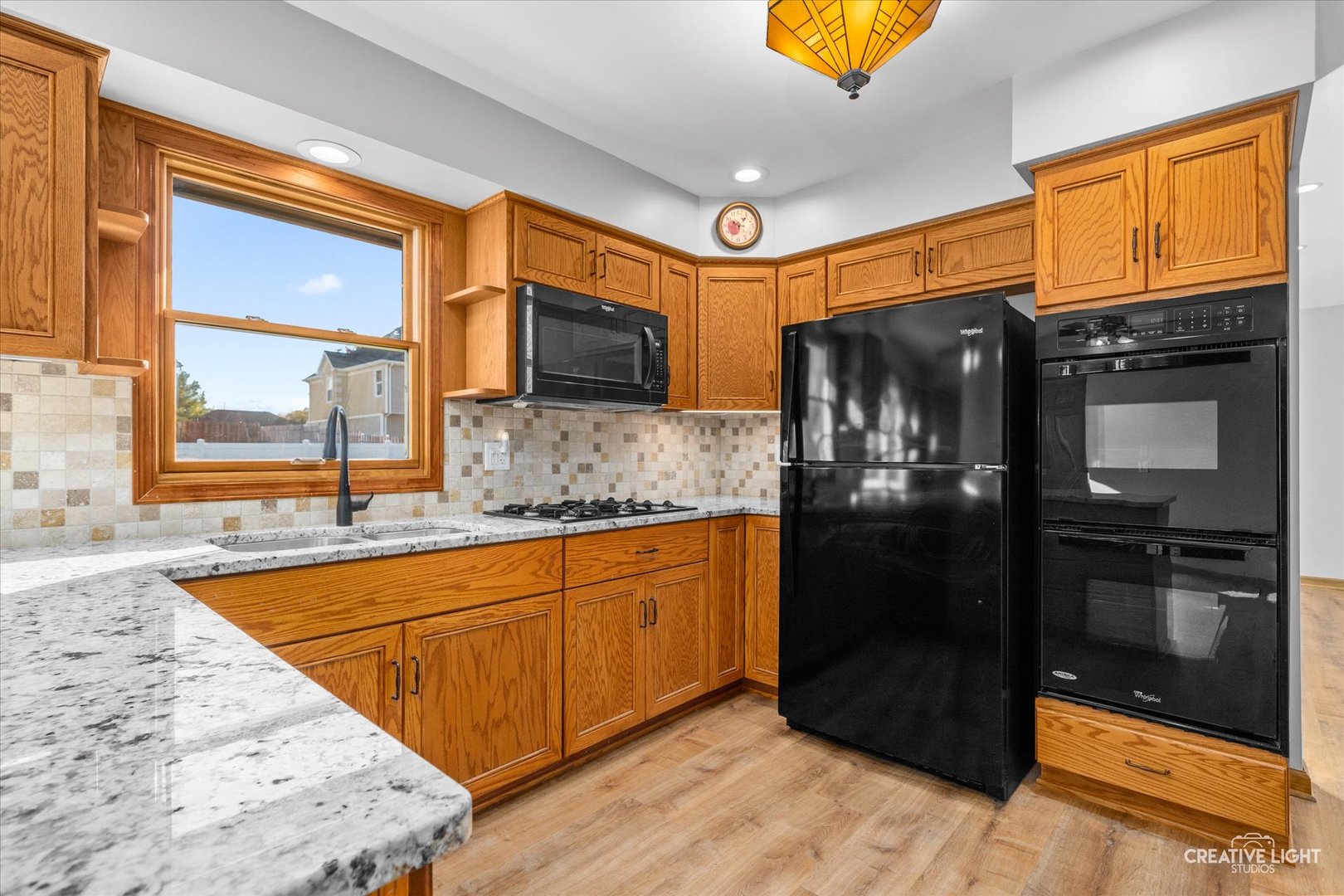 1111 Laurel Drive Aurora, IL 60506 - Photo 5 of 22 a kitchen with stainless steel appliances granite countertop a refrigerator and a sink