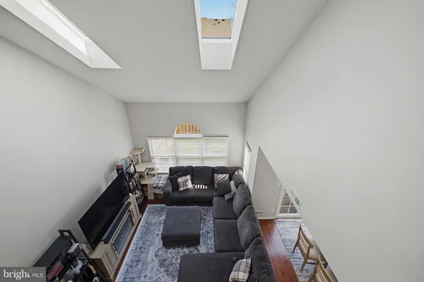 a view of a livingroom with furniture and a window