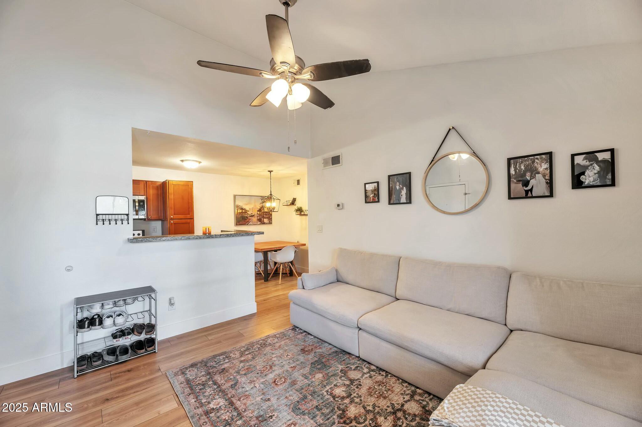 623 West Guadalupe Road, Unit 213 Mesa, AZ 85210 - Photo 1 of 21 a living room with furniture and kitchen view