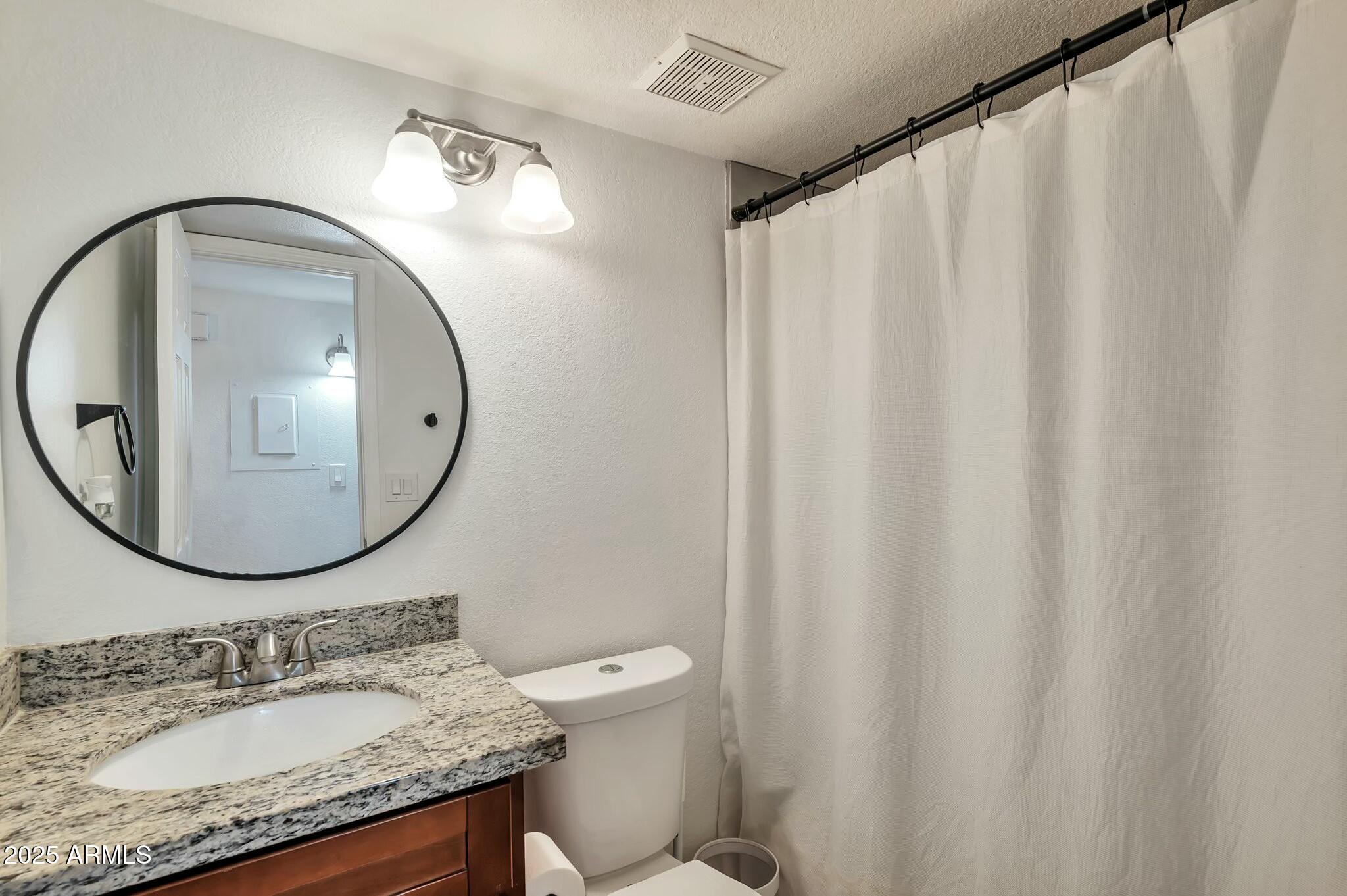 623 West Guadalupe Road, Unit 213 Mesa, AZ 85210 - Photo 8 of 21 a bathroom with a sink and a mirror