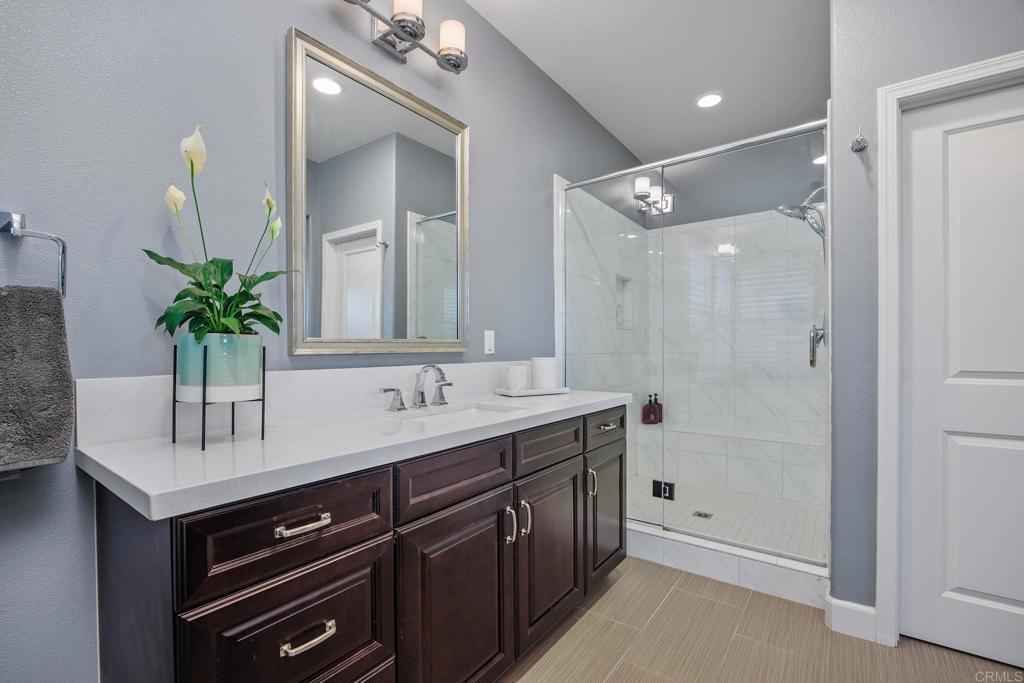 13525 Cielo Ranch Road San Diego, CA 92130 - Photo 23 of 49 a bathroom with a sink and a mirror