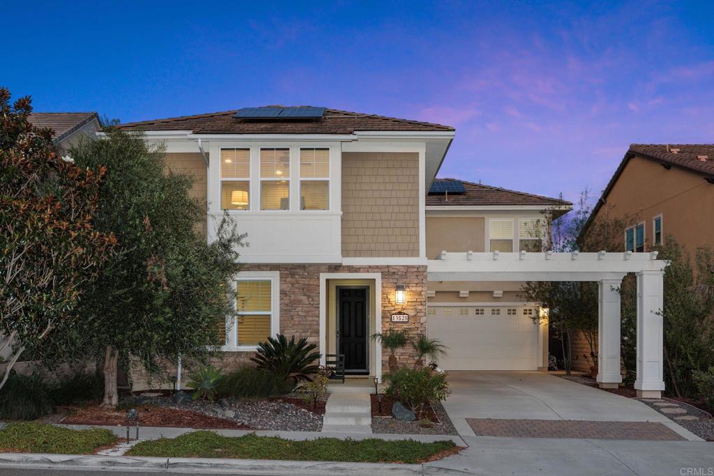13525 Cielo Ranch Road San Diego, CA 92130 - Photo 27 of 49 a front view of a house with a yard