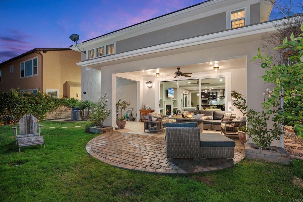 13525 Cielo Ranch Road San Diego, CA 92130 - Photo 4 of 49 a view of a house with backyard and sitting area