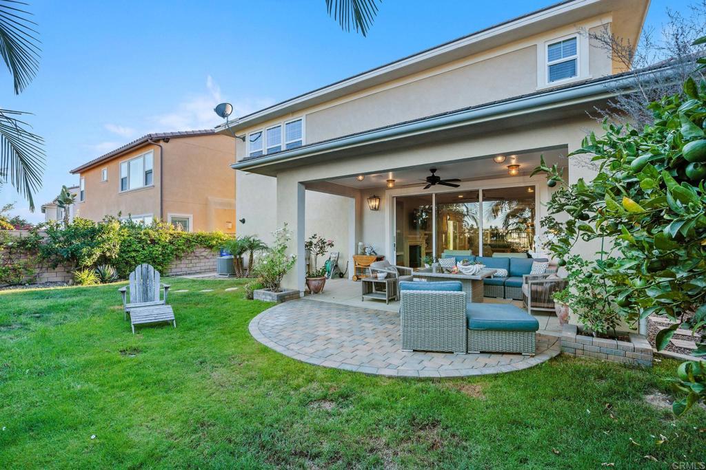 13525 Cielo Ranch Road San Diego, CA 92130 - Photo 43 of 49 a view of a chair and table in backyard of the house