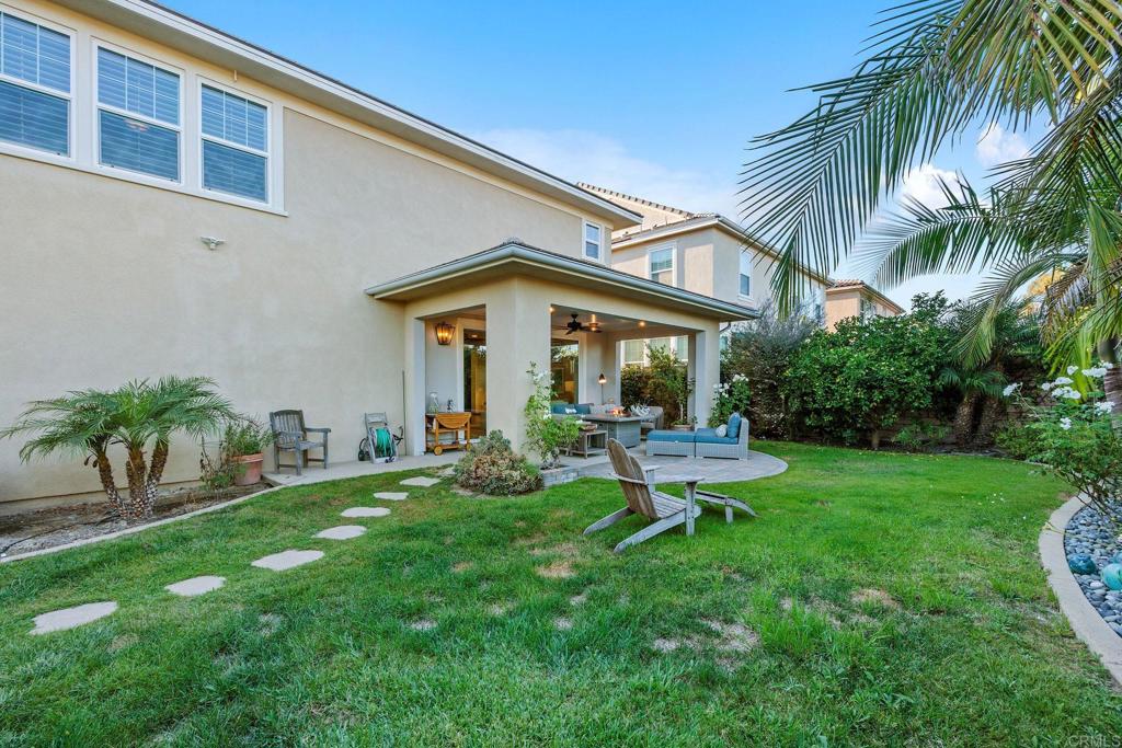 13525 Cielo Ranch Road San Diego, CA 92130 - Photo 44 of 49 a view of a chair and table in backyard of the house