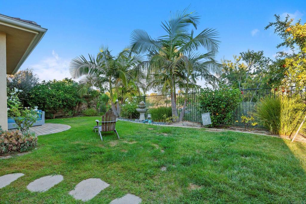 13525 Cielo Ranch Road San Diego, CA 92130 - Photo 45 of 49 a garden with trees in front of it