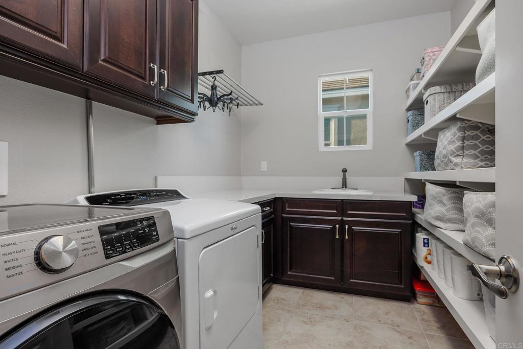 13525 Cielo Ranch Road San Diego, CA 92130 - Photo 48 of 49 a kitchen with a stove and a sink