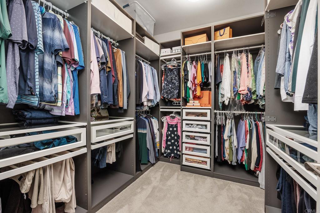 13525 Cielo Ranch Road San Diego, CA 92130 - Photo 49 of 49 a view of walk in closet with clothes and shoes