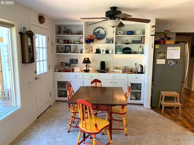a dining room with furniture and window