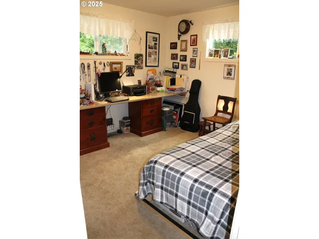 a bedroom with bed and a window