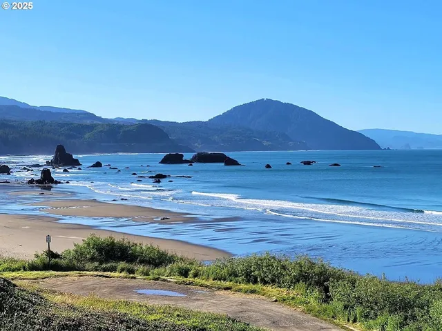 a view of a large mountain with sunset view