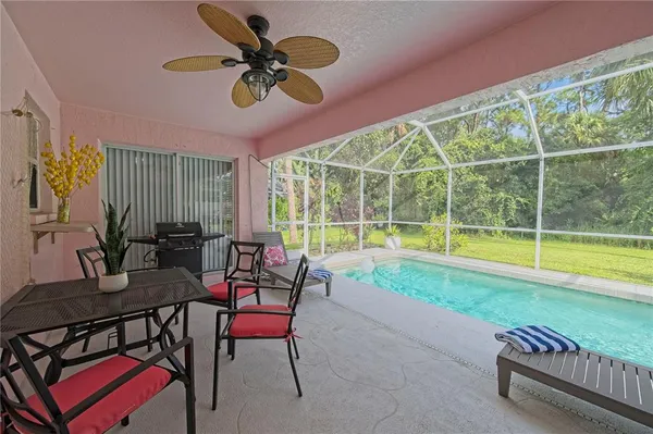 a view of a dining room with furniture window and outside view