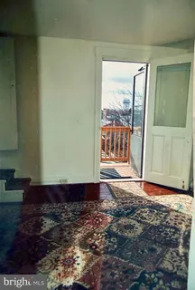 a view of a bathroom with wooden floor