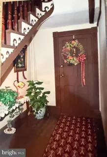 a vase of flowers sitting on a floor