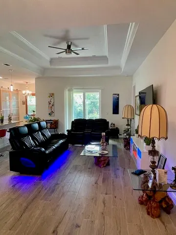 a living room with furniture or couch and a wooden floor