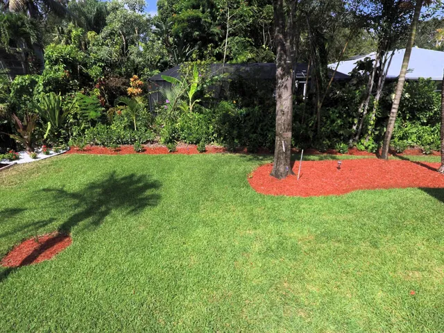 a view of a backyard with entertaining space