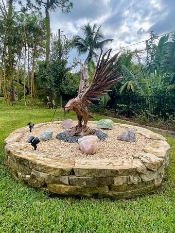 a view of a wooden house with a yard