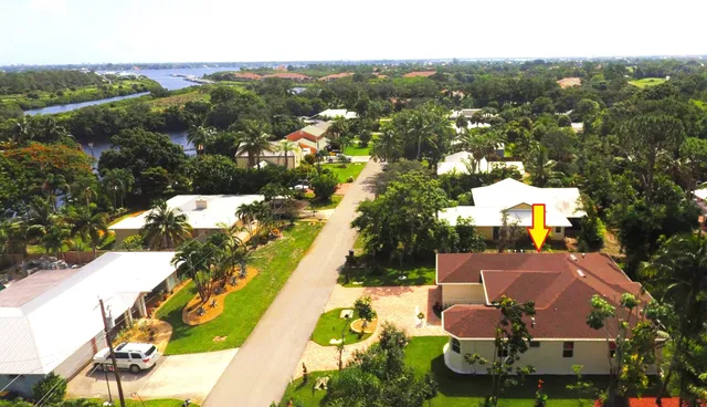 an aerial view of a house with a garden