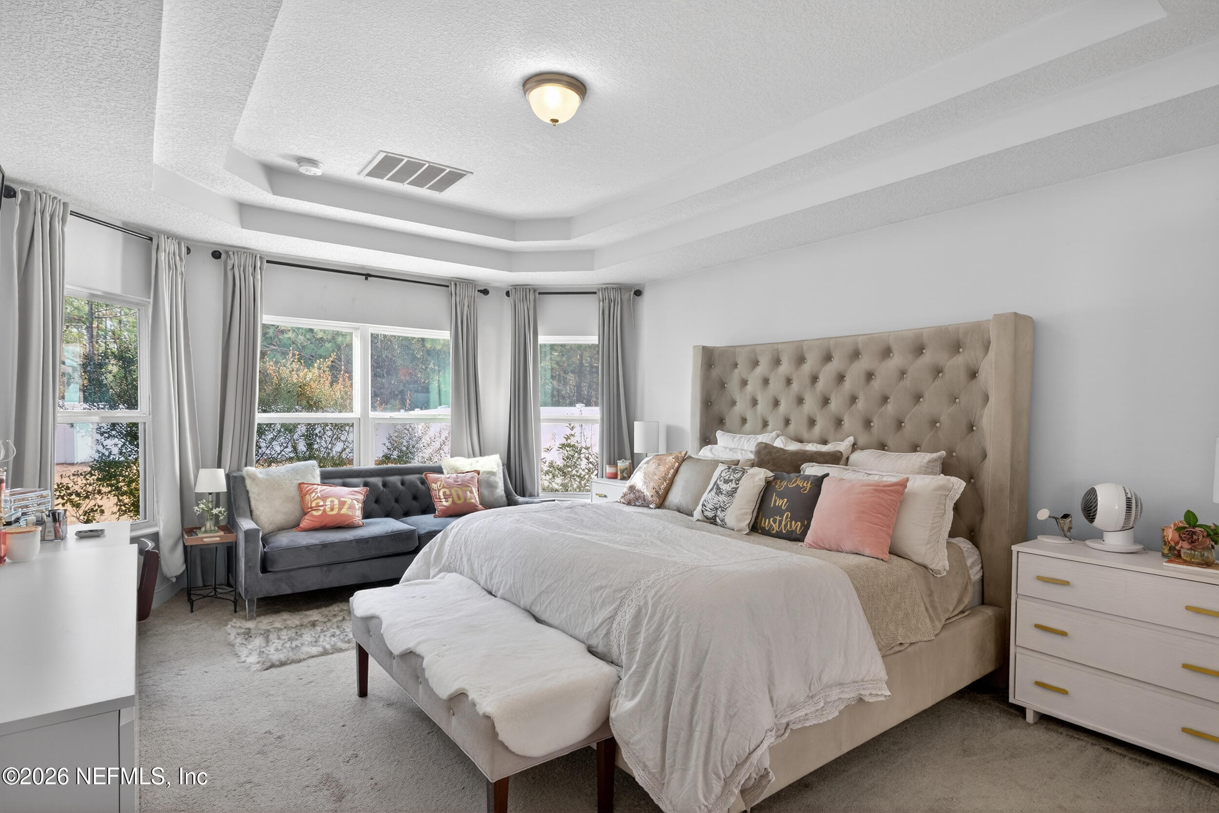 9874 Patriot Ridge Drive Jacksonville, FL 32221 - Photo 11 of 26 a bedroom with a bed and glass window