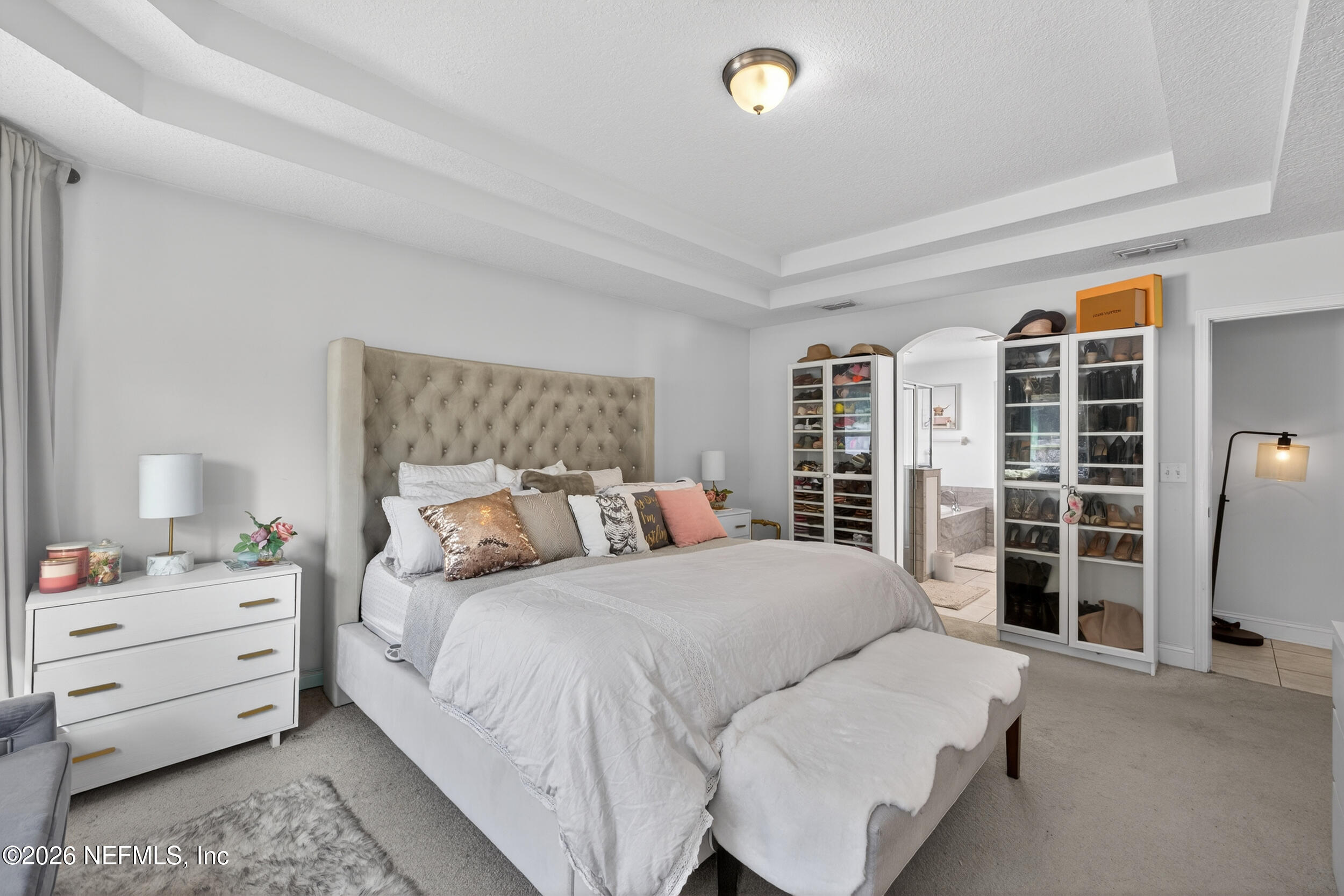 9874 Patriot Ridge Drive Jacksonville, FL 32221 - Photo 12 of 26 a bedroom with a large bed and a window