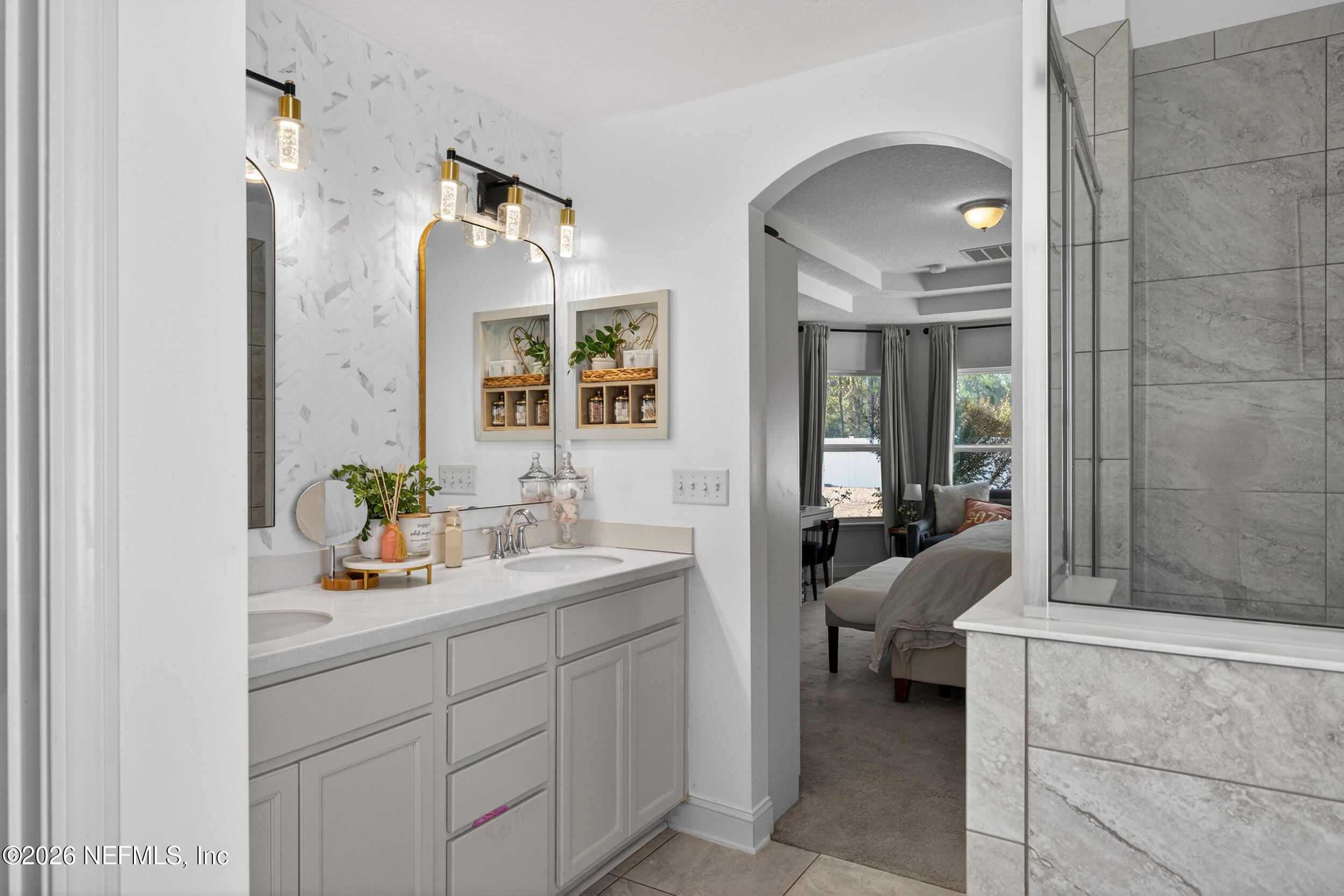 9874 Patriot Ridge Drive Jacksonville, FL 32221 - Photo 14 of 26 a spacious bathroom with a double vanity sink and a mirror