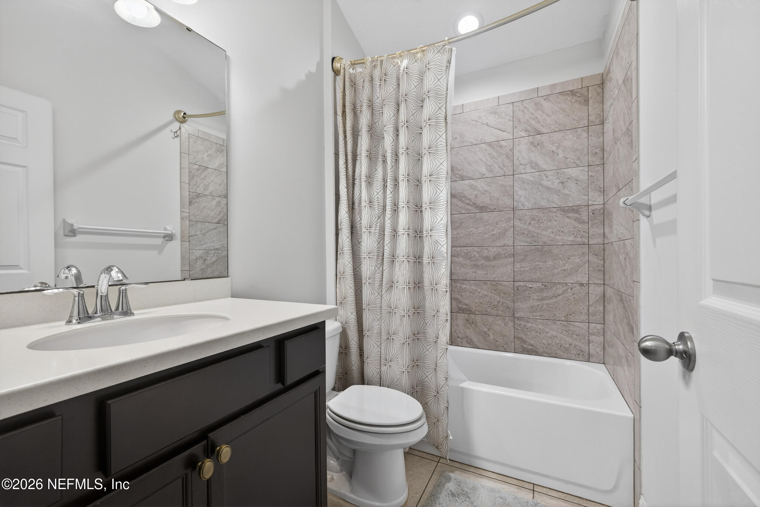 9874 Patriot Ridge Drive Jacksonville, FL 32221 - Photo 19 of 26 a bathroom with a sink toilet and shower