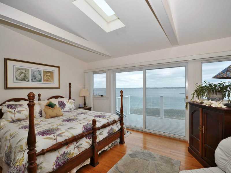 16 East Shore Road Jamestown, RI 02835 - Photo 13 of 20 Master Bedroom. The master bedroom deck is a great place for morning coffee!