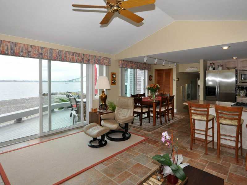 16 East Shore Road Jamestown, RI 02835 - Photo 4 of 20 Den/Family/Great Room. Family room, dining area and kitchen all enjoy water views.