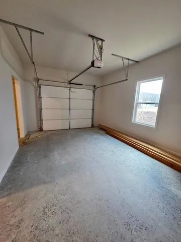 a view of an empty room with windows